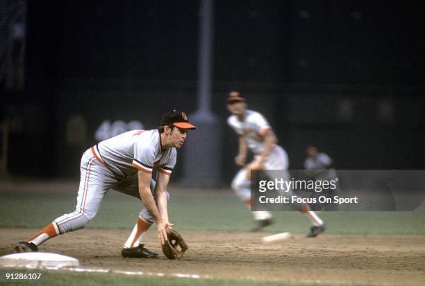 Third baseman Brooks Robinson of the Baltimore Orioles in action fielding a ground ball at third base during a circa 1970's Major League Baseball...