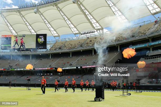 The Scorchers run out to field during the Women's Big Bash League match between the Sydney Thunder and the Perth Scorchers at Optus Stadium on...