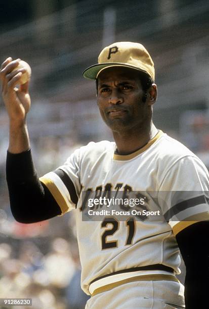 Outfielder Roberto Clemente of Pittsburgh Pirates warms up before a MLB baseball game circa early 1970's. Clemente' Played for the Pirates from...