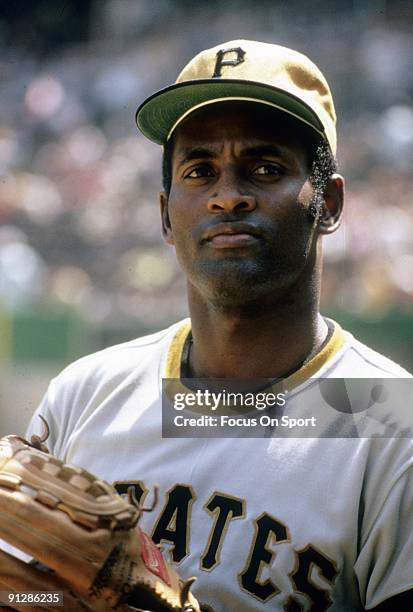 Outfielder Roberto Clemente of Pittsburgh Pirates warms up before a MLB baseball game circa early 1970's. Clemente' Played for the Pirates from...