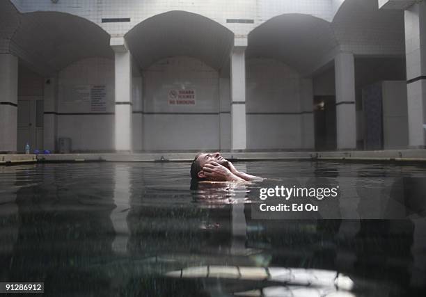 Doctor fish' eat the dead skin off of a psoriasis patient as part of his treatment on September 14, 2009 in Kangal, 105 kilometers south of the...