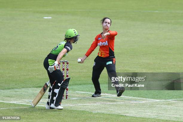 Emma King of the Scorchers bowls during the Women's Big Bash League match between the Sydney Thunder and the Perth Scorchers at Optus Stadium on...