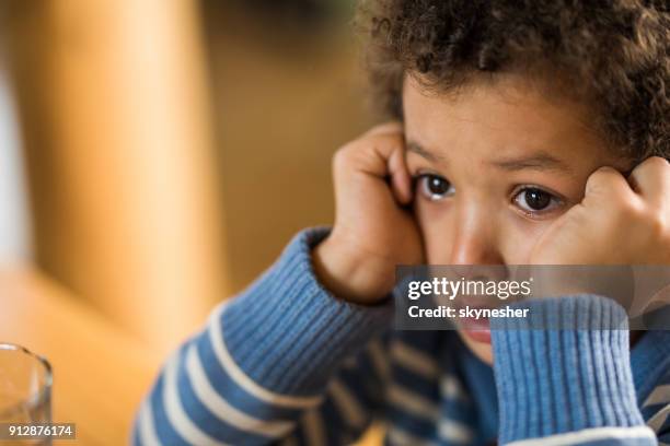 close up of crying little black boy. - sad black child crying stock pictures, royalty-free photos & images