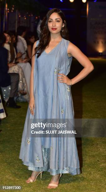 Indian Bollywood actress Yami Gautam poses for a photograph at Lakmé Fashion Week Summer Resort 2018 in Mumbai on January 31, 2018. / AFP PHOTO /...