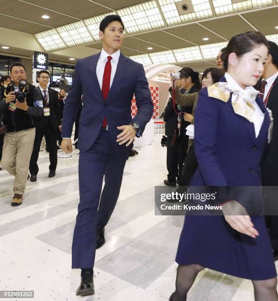 Los Angeles Angels player Shohei Ohtani walks out from the venue of a send-off ceremony at Narita airport in Japan on Feb. 1 before his departure to...
