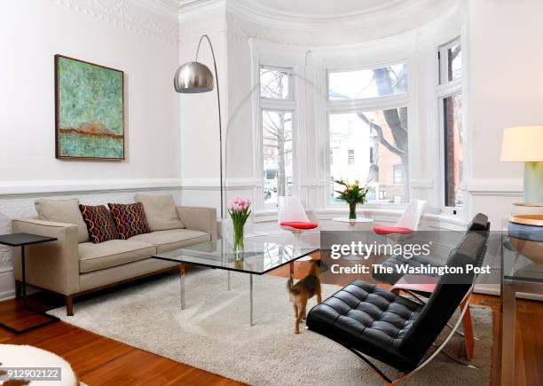 The living room of David Feinstein and Susan Pitman's renovated home still has chair rail molding and Victorian details January 04, 2018 in...