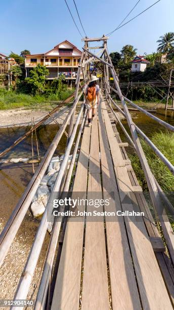 wooden bridge over the nam song river - nam song river stock pictures, royalty-free photos & images