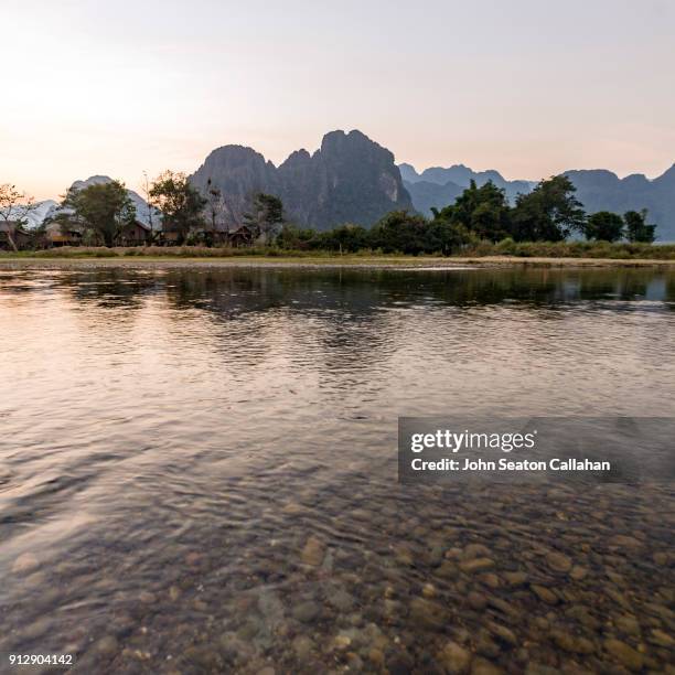 sunset on the nam song river - nam song river stock pictures, royalty-free photos & images