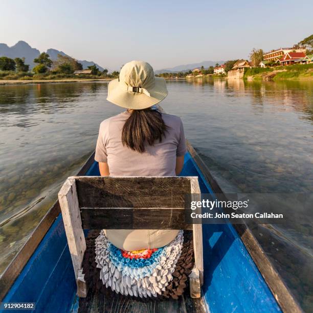 boating on the nam song river - nam song river stock pictures, royalty-free photos & images