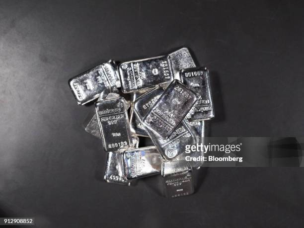 Pile of 500 gram silver bars sit in a storage tray in this arranged photograph in the precious metals deposit vaults of Pro Aurum KG in Munich,...