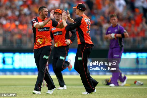 Tim Bresnan and Adam Voges of the Scorchers celebrate the wicket of Matthew Wade of the Hurricanes during the Big Bash League Semi Final match...