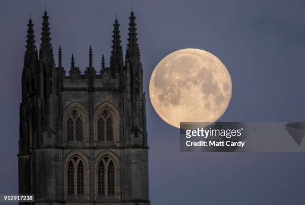 Super Blue Blood Moon sets behind Downside Abbey, a Benedictine monastery, in Stratton-on-the-Fosse on February 1, 2018 in Somerset, England. Last...