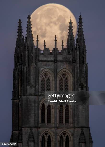 Super Blue Blood Moon sets behind Downside Abbey, a Benedictine monastery, in Stratton-on-the-Fosse on February 1, 2018 in Somerset, England. Last...