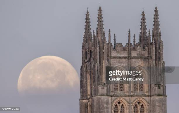 Super Blue Blood Moon sets behind Downside Abbey, a Benedictine monastery, in Stratton-on-the-Fosse on February 1, 2018 in Somerset, England. Last...