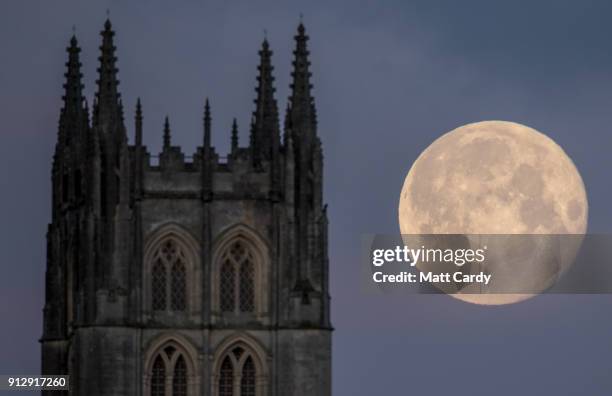 Super Blue Blood Moon sets behind Downside Abbey, a Benedictine monastery, in Stratton-on-the-Fosse on February 1, 2018 in Somerset, England. Last...