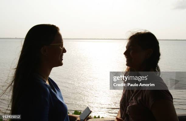 two youg girls enjoying in the amazon in brazil - amazon jungle girls stock pictures, royalty-free photos & images