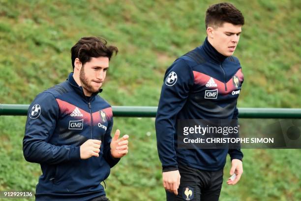 French scrumhalf Maxime Machenaud and French flyhalf Matthieu Jalibert attend a training session after the annoucement of the French rugby team for...