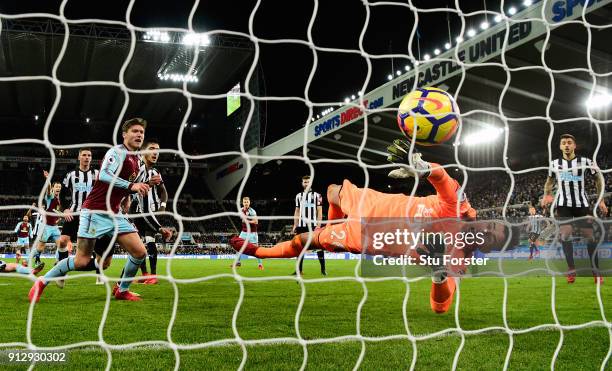 Newcastle goalkeeper Karl Darlow is beaten by a Sam Vokes header for the Burnley goal during the Premier League match between Newcastle United and...