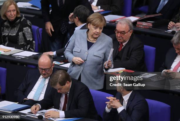 German Chancellor Angela Merkel attends debates at the Bundestag over a proposal concerning the rights of refugees who have been granted limited...