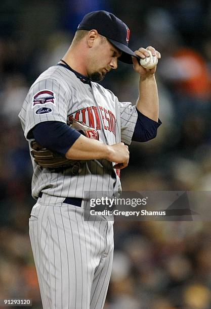 Pitcher Jesse Crain of the Minnesota Twins looks down after a walk against the Detroit Tigers during the game on September 30, 2009 at Comerica Park...