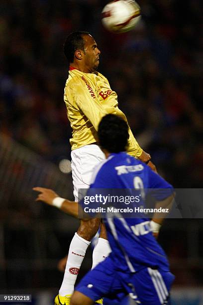 Mauricio Victorino of Universidad de Chile vies for the ball with Alecsandro of Brazil's International during the Copa Nissan Sudamericana at Santa...