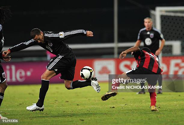 Danny Szetela of US team DC United controls the ball in front of Devon Jamerson of Trinidad and Tobago team San Juan Jabloteh during a Group B...