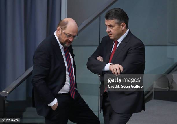 Martin Schulz , head of the German Social Democrats , chats with SPD member and interim German Foreign Minister Sigmar Gabriel at the Bundestag...