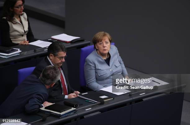 German Chancellor Angela Merkel attends debates at the Bundestag over a proposal concerning the rights of refugees who have been granted limited...