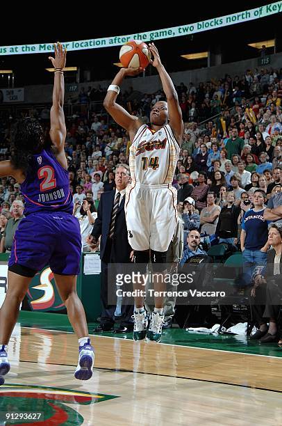 Shannon Johnson of the Seattle Storm shoots over Temeka Johnson of the Phoenix Mercury during the WNBA game on September 10, 2009 at the Key Arena in...