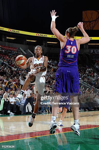 La'Tangela Atkinson of the Seattle Storm goes up against Nicole Ohlde of the Phoenix Mercury during the WNBA game on September 10, 2009 at the Key...