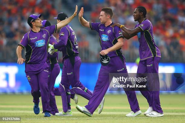 Tom Rogers of the Hurricanes celebrates the wicket of Shaun Marsh of the Scorchers during the Big Bash League Semi Final match between the Perth...