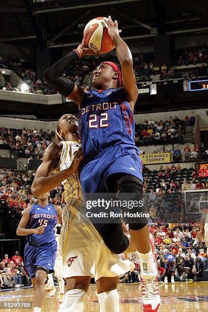 Alexis Hornbuckle of the Detroit Shock goes up for a shot againts Tamika Catchings of the Indiana Fever in Game Three of the Eastern Conference...