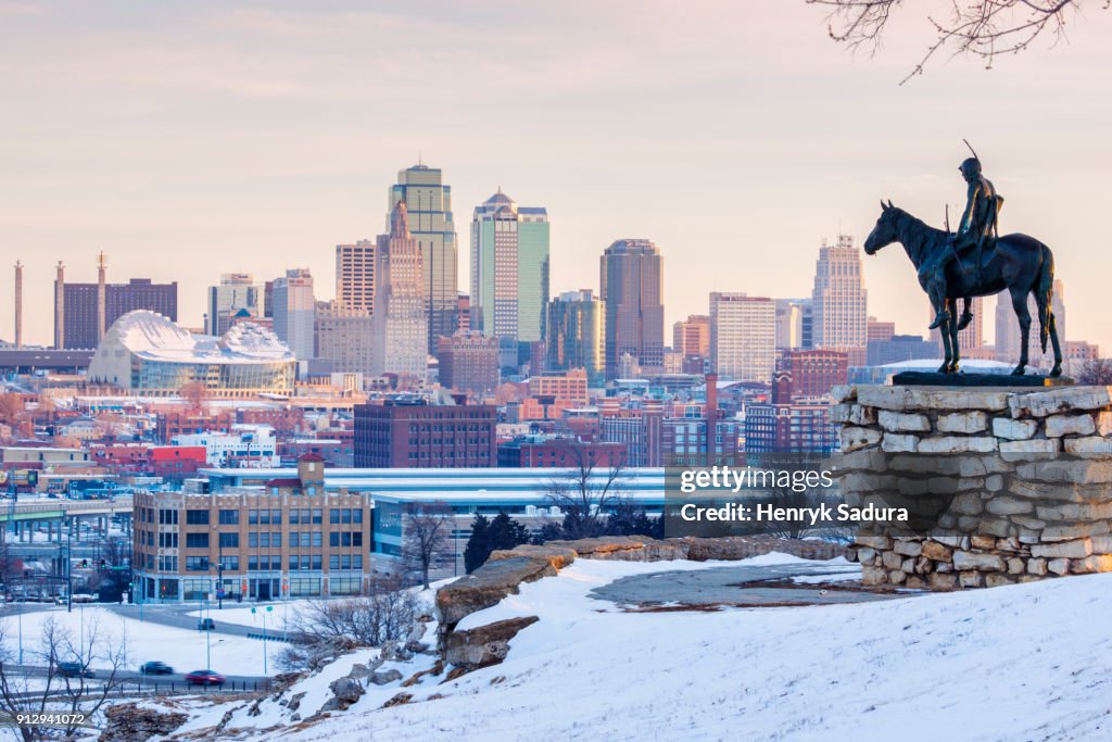 The Scout statue and Kansas City panorama at sunrise