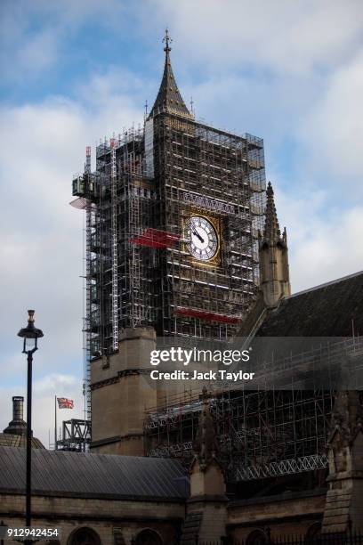 The Elizabeth Tower, commonly known as Big Ben stands covered in scaffolding beside the Houses of Parliament in Westminster on February 1, 2018 in...