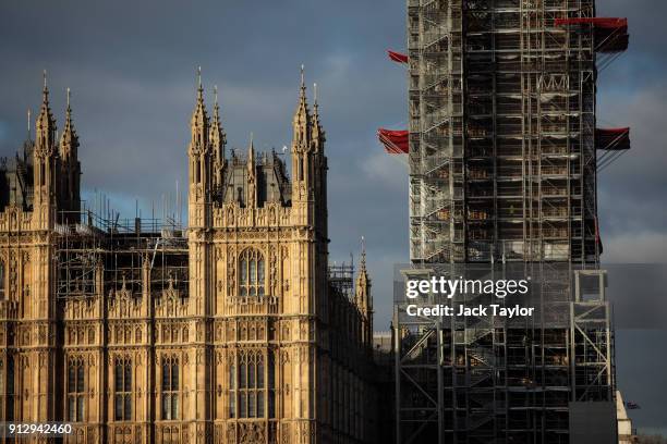 The Elizabeth Tower, commonly known as Big Ben stands covered in scaffolding beside the Houses of Parliament in Westminster on February 1, 2018 in...