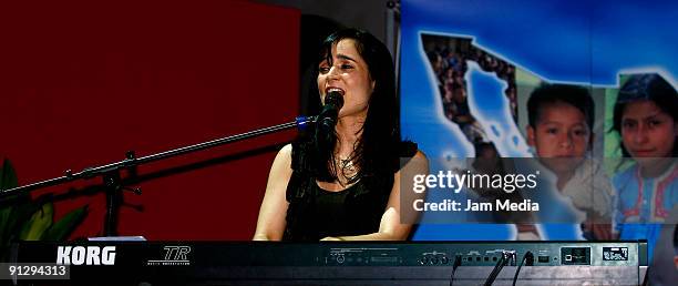 Singer Julieta Venegas performs during a ceremony for her appointment as ambassador of the good will for UNICEF at the Indianilla Station on...