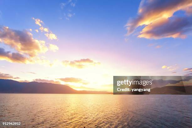 sunset with dramatic clouds on the tropical beach - early morning sky stock pictures, royalty-free photos & images