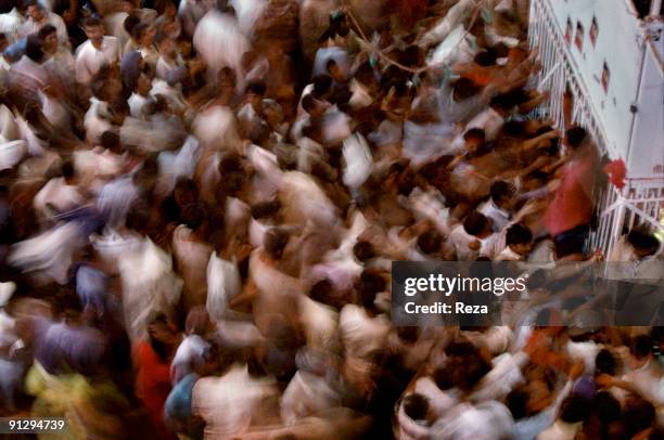 Group of pilgrims and devotees inside of Lal shahbaz Qalandar shrine, a 13th century Sufi Master worshiped alike by Hindus and Muslims, September,...