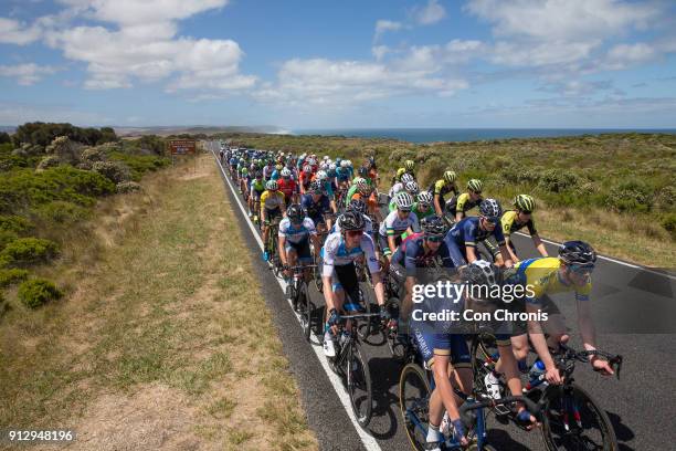 Calvin Watson of Australia and Aqua Blue Sports and yellow jersey leader Edward Clancy of Great Britain and JLT Condor lead the peloton through Port...