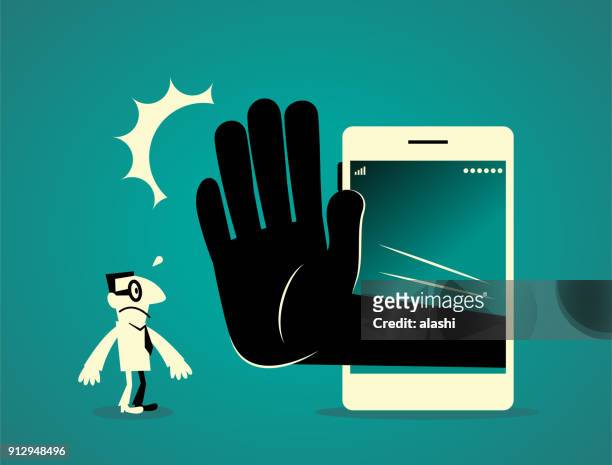geschäftsmann stand vor einem großen smartphone (handy) mit einer großen hand stop geste (nein!) - ausschluss stock-grafiken, -clipart, -cartoons und -symbole