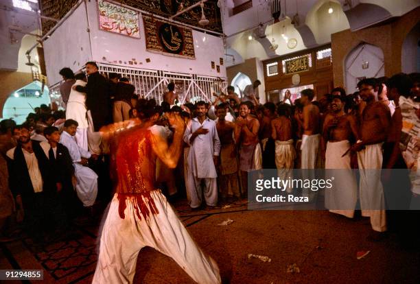 Self mutilation of Shi'as, during the annual ceremony of Urs of Lal Shabaz Qalandar at the entrance of his shrine, September, 2006 in Sehwan Sharif,...