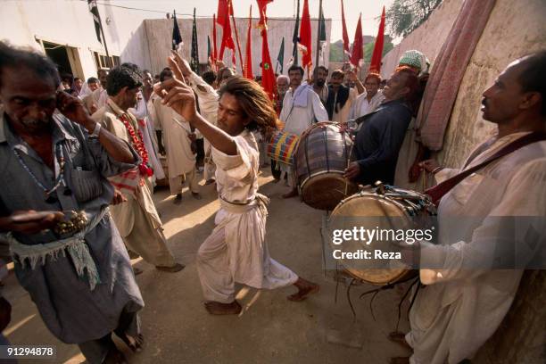 Whirling dervish during mystic celebrations at the shrine of Lal shahbaz Qalandar a 13th century Sufi Master worshiped alike by Hindus and Muslims,...