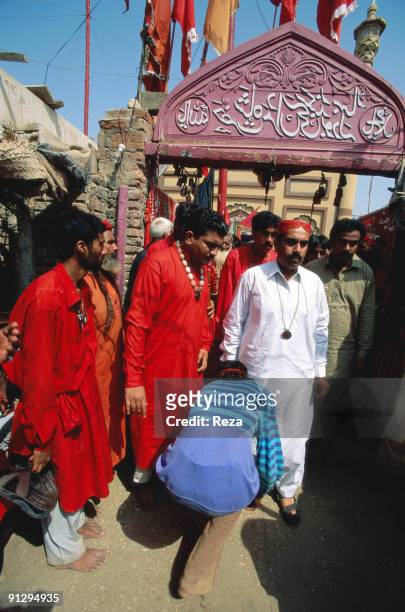 At the entrance of the shrine of Sufi Bodla Bahar, a devotee honouring the sufi master , Sheikh Akhtar Hussein Pirzada, titled as Noor Ali Shah,...