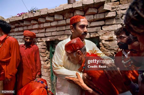 Pir Ali Heydar Shah greeting sufi master , Sheikh Akhtar Hussein Pirzada, titled as Noor Ali Shah, at the entrance of a special room where he changes...