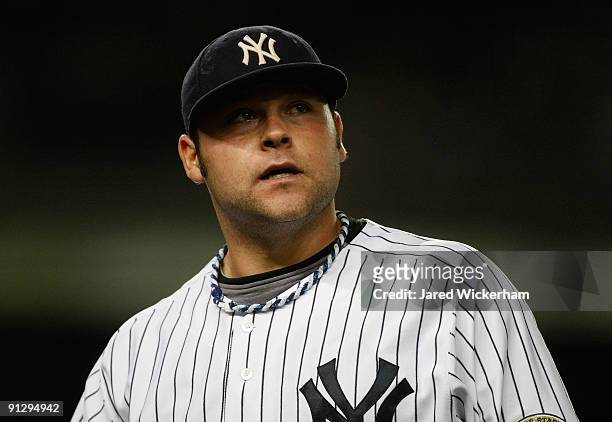 Joba Chamberlain of the New York Yankees walks off the field after being relieved in the 4th inning during the game on September 30, 2009 at Yankee...