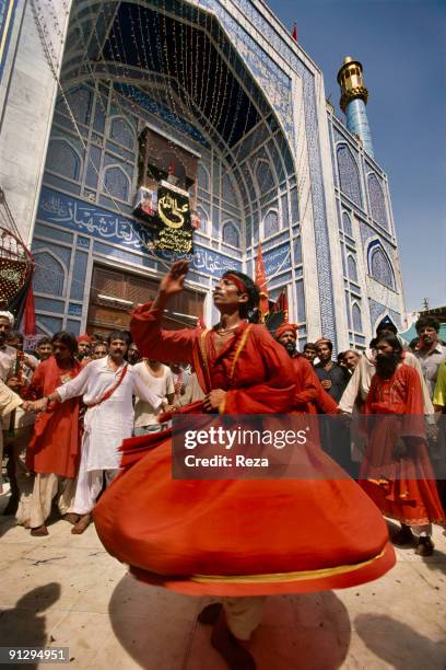 Whirling dervishes during the annual celebration of the Urs of Lal shahbaz Qalandar, a 13th century Sufi Master worshiped alike by Hindus and...