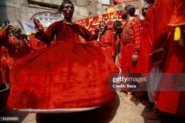 Whirling dervishes during the annual celebration of the Urs of Lal shahbaz Qalandar, a 13th century Sufi Master worshiped alike by Hindus and...