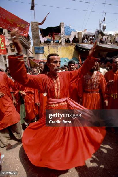 Whirling dervishes during the annual celebration of the Urs of Lal shahbaz Qalandar, a 13th century Sufi Master worshiped alike by Hindus and...