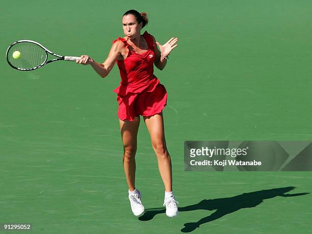 Jelena Jankovic of Ser bia plays a forehand in her match against Marion Bartoli of France during day five of the Toray Pan Pacific Open Tennis...