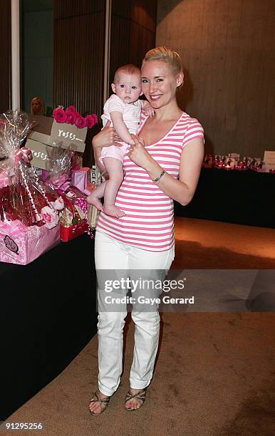 Personality, Radio Host and Author Bessie Bardot with her baby Bluebell pose during the McGrath Foundation High Tea at the Ivy on October 1, 2009 in...